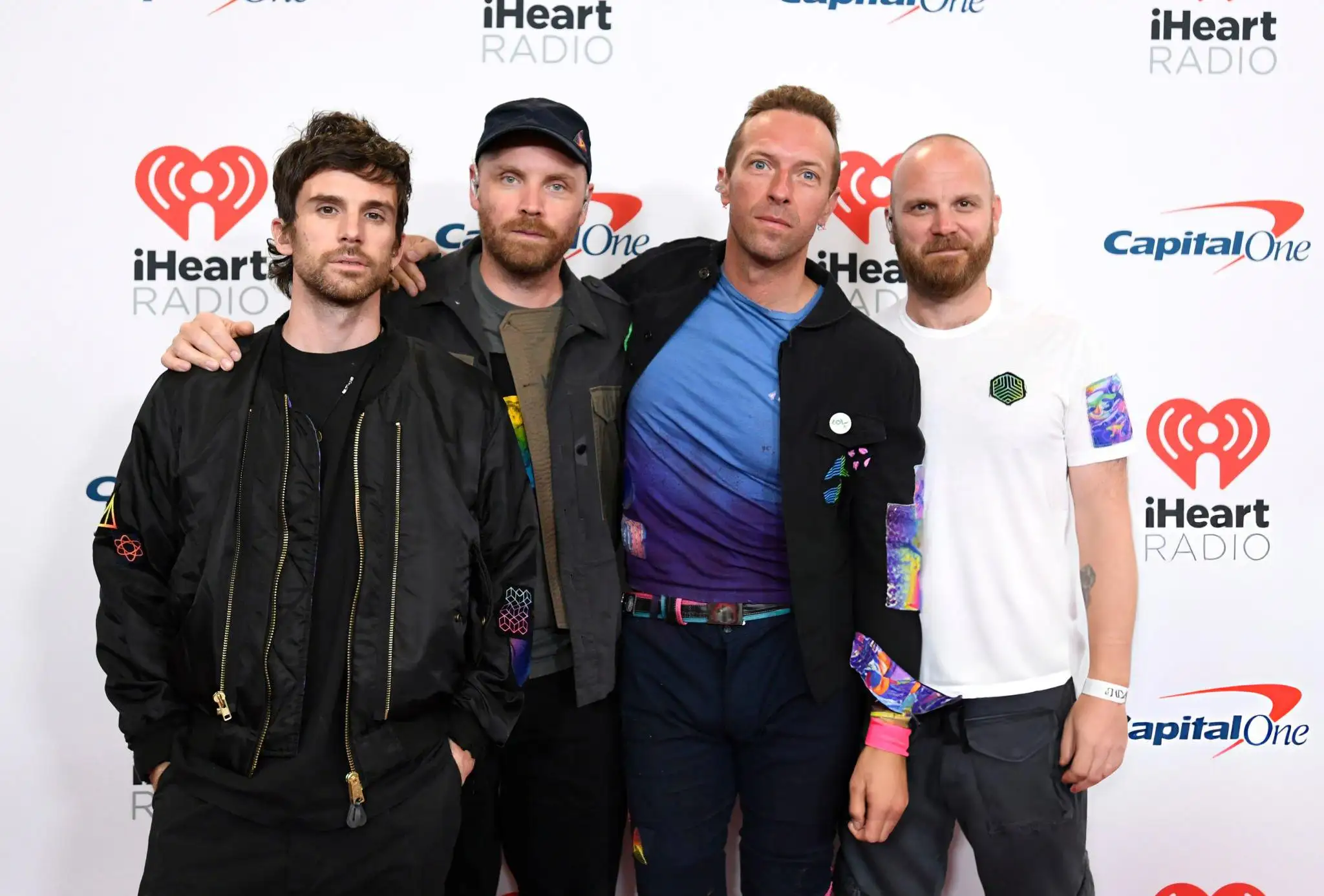 Coldplay Members: Guy Berryman, Jonny Buckland, Chris Martin, and Will Champion