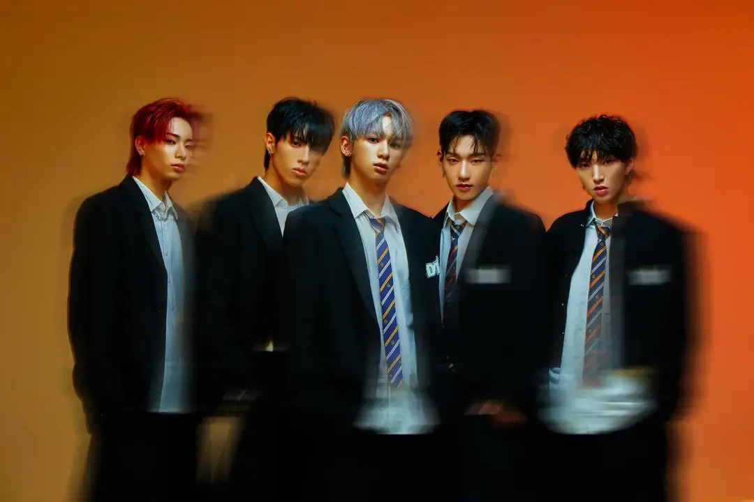 DXMON members are Minjae, Seita, Hee, TK, and Rex.