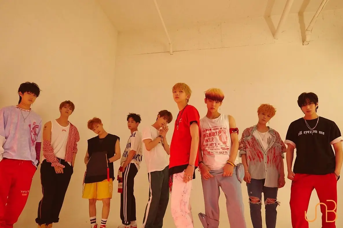 UNB members are Feeldog, Euijin, Daewon, Marco, Hojung, Hansol, Jun, Chan, and Kijoong.